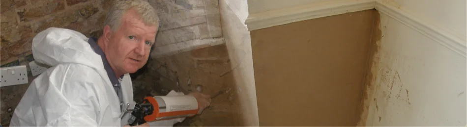 Trident surveyor-operative injecting a damp-proof course