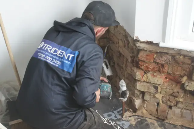 Drilling the mortar course for DPC injection