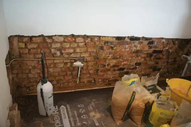 DPC treatment underway on stripped brickwork