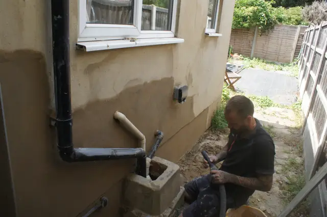 External repairs at the base of the wall