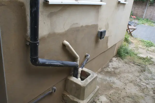 External render made good around the pipework