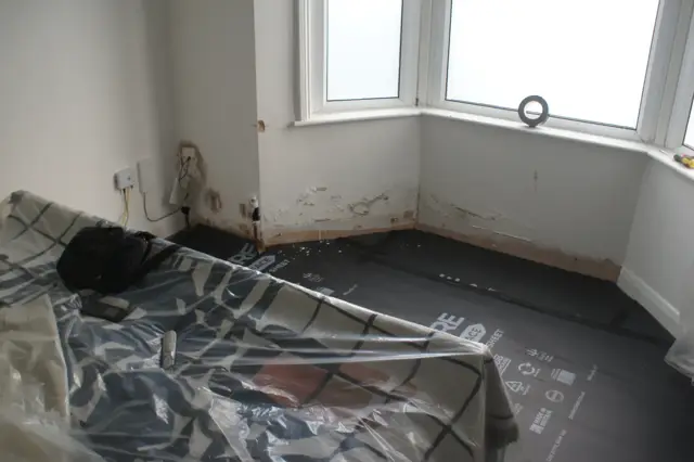 Floors sheeted and protected wall to wall