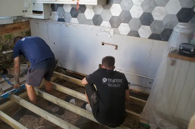 Rotten kitchen floor out, new treated joists in