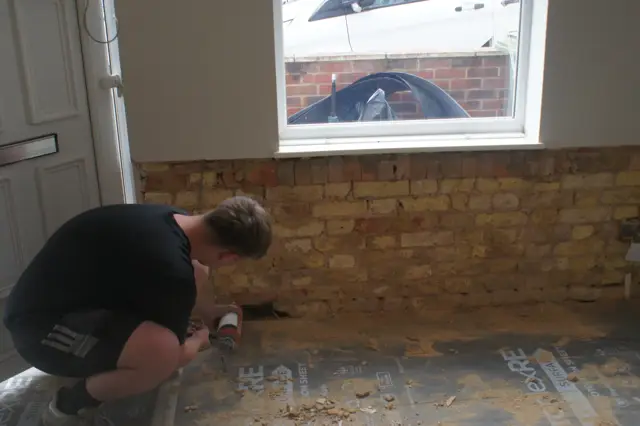 Plaster off at low level, wall ready to prep
