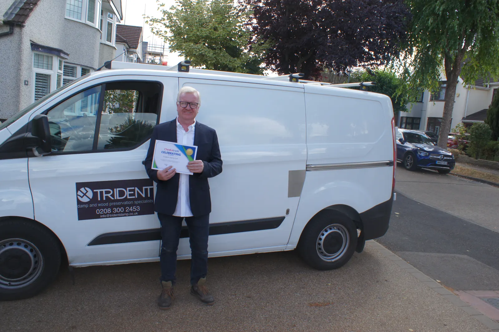 Joseph O'Regan, Managing Director of Trident Damp, with the sign-written company van