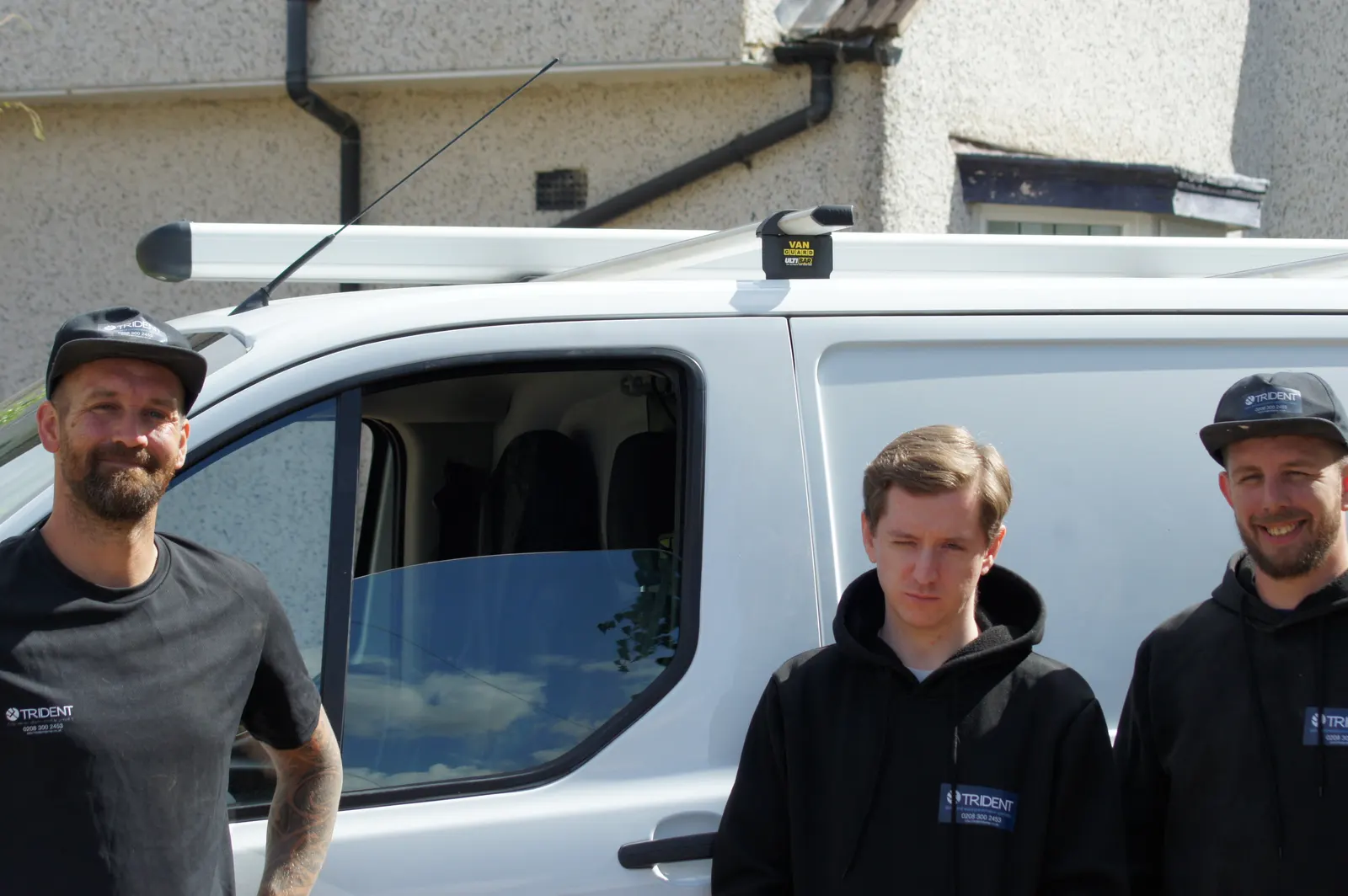 Trident Damp team leaders with Joe's son, the company apprentice, by the van