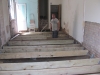 New joists treated timbers on joist hangers to keep away from floor and walls